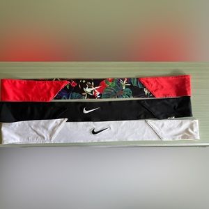Nike headbands. White. Black. Red with floral pattern.